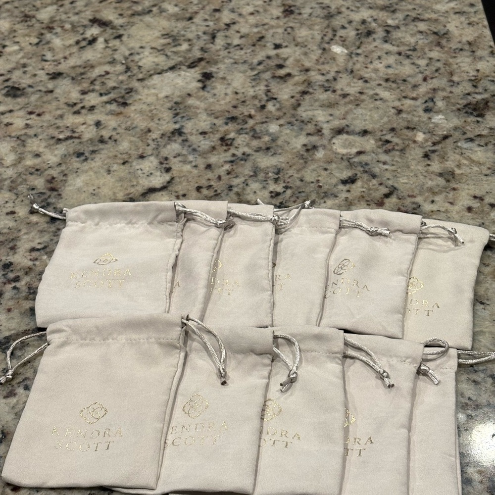 Kendra Scott Cream Pouches with Gold Logo